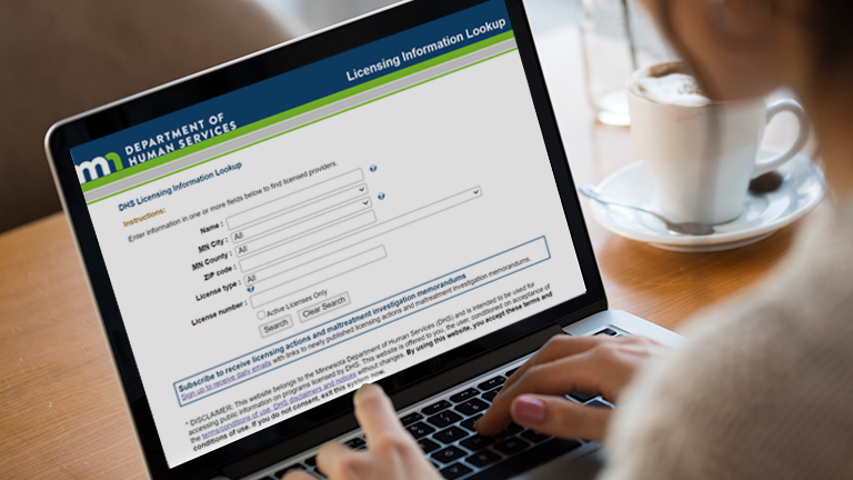 DHS license lookup tool displayed on laptop